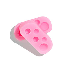 Paletas Mini Silicone Palette en silicona rosa con compartimentos numerados
